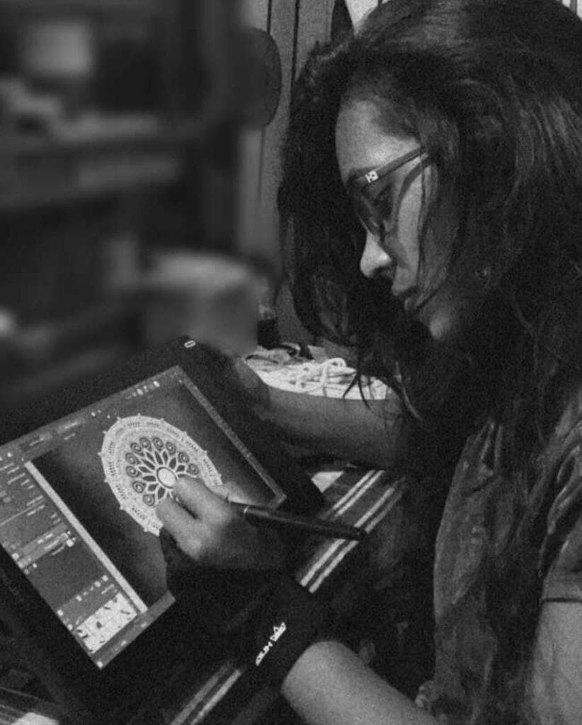 Prabha Hewage sketching on a digital pad